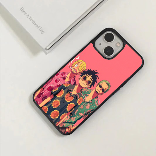 Bright pink phone case featuring Luffy, Zoro, and Sanji from One Piece wearing matching floral summer shirts.